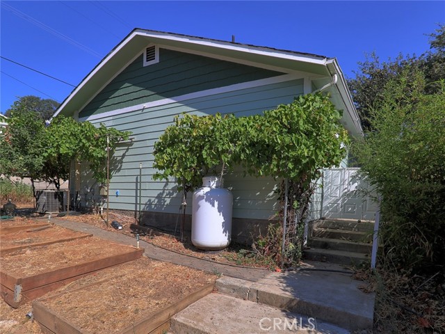 Back/Side yard planter boxes and stairs to Back/Side yard French doors to Master Bed, Kitchen and Garage
