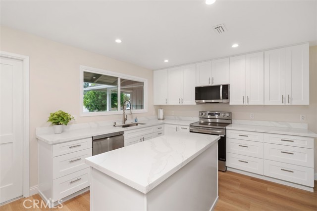 Center kitchen island provides additional counterspace and storage