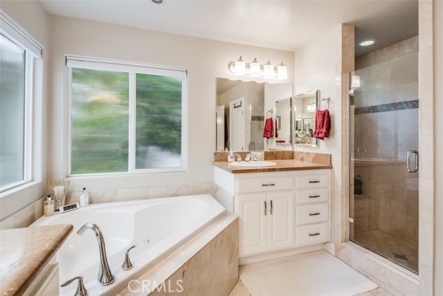 Primary bath with jacuzzi tub and walk in shower