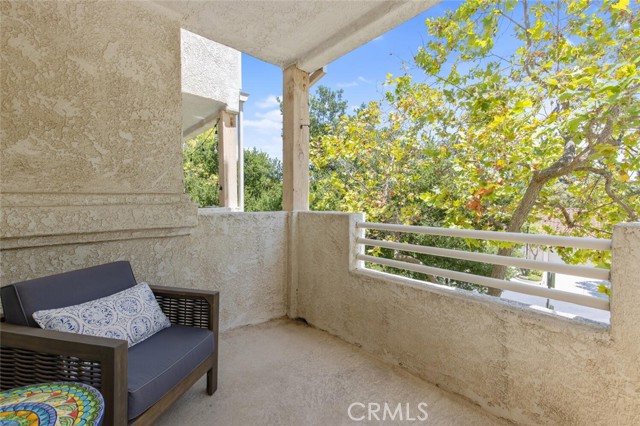 Private covered patio just off your living area with peaceful, green and mountain views.