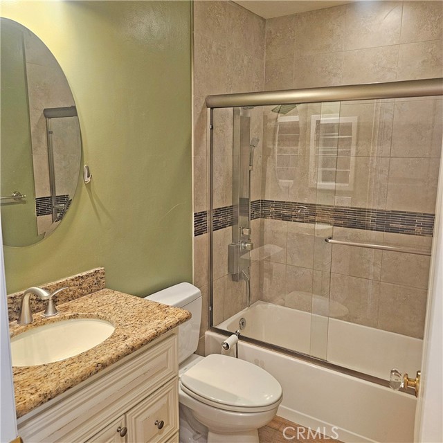 Guest Bathroom with tiled tub and rain shower