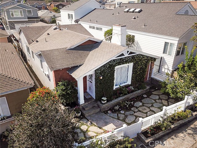528 Marine Avenue Manhattan Beach, California For COMP purposes only. Quintessential Beach Bungalow in the GAS LAMP area of Manhattan Beach. It begins with the classic, vintage curb appeal: white fence, ivy covered exterior, Dutch entry door, and period latticework windows. This charming home (on a street to alley lot) offers the traditional 3 bedrooms, 2 bathrooms, with a NEW tasteful white kitchen, open floor plan with a gorgeous white brick living room fireplace, wood floors & vaulted, shiplap ceilings. There are also several ORIGINAL, very unique features including glass paned interior doors, old fashioned window locks, and latticework windows. Two outdoor areas are perfect for morning coffee after your beach walk! Perhaps the best attribute is the home's location. 5 blocks gets you to the BEACH, Live Oak Park, The Tot Lot, Grandview School, Sand Dune Park, Green Belt/Chip Path and is close to DOWNTOWN. It's turnkey and ready for you to come home.