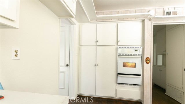 Entrance to kitchen. Wall oven and pantry