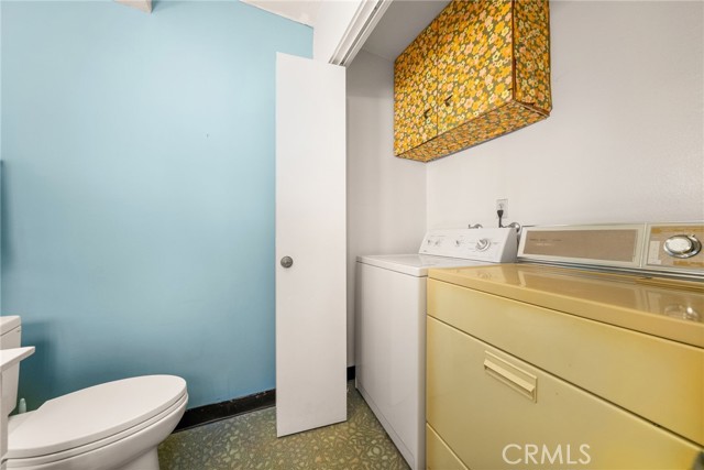 Main unit downstairs bathroom with laundry area