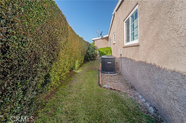 Picture of the South side of the home.  The home has central heating air, see the air condenser on this picture.