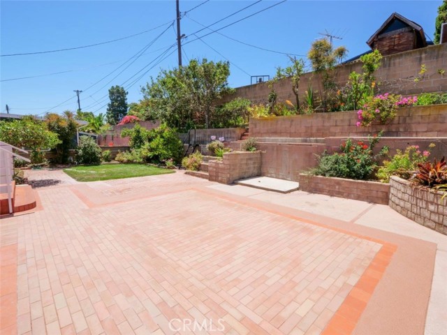 Patio looking at terraced walls with fruiting plants