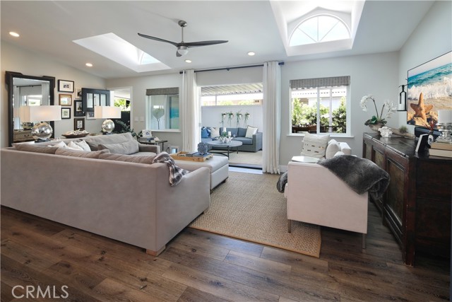 Living room view towards entrance to deck and outdoor living space. Open living space with plenty of light.