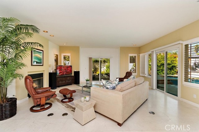 Family Room opens to both the Alumawood patio and pool.