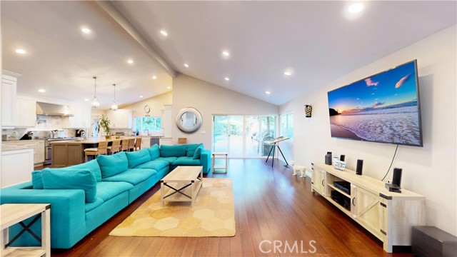 Spacious living room with vaulted ceilings and recessed light