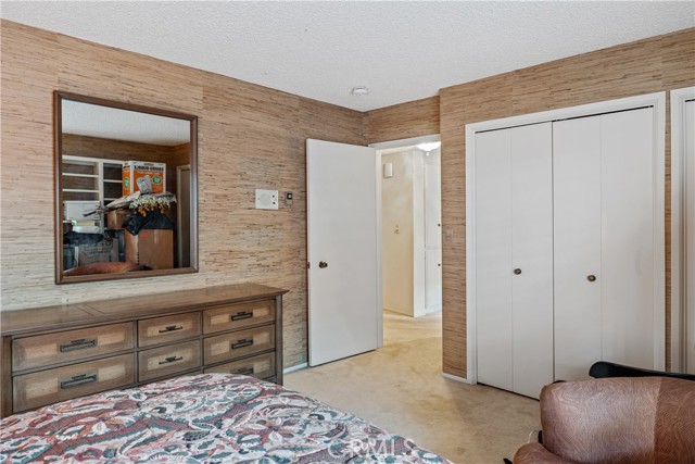 Bedroom #2 - Spacious, appointed with ornate wall-covering decor, and  plenty of closet space.