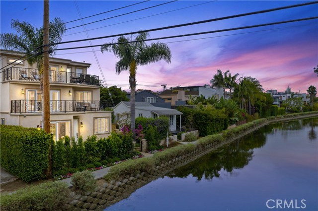 3000 Grand Canal Venice, California Venice Investors Premiere Opportunity - A Once in a Lifetime Chance to Own a 5 Unit Luxury Property on the Historic Venice Canal Front. Located just steps to the World Renowned Venice Washington Square, Boardwalk and Pier. This Beautiful Mediterranean Style Building is a Crown Jewel of the Venice Canals. The Owners Unit is an Elegant Three Story Mediterranean Retreat with an Elevator and faces the Canal with Incredible Views of the Historic Venice / Canal Area and Views from Marina del Rey to Santa Monica to Beverly Hills and the Beautiful Foothills and beyond. Composed of 4 Beautiful very spacious Bedrooms and 4.5 Luxurious Bathrooms. This Luxurious Retreat is perfect to live in or to earn top dollars on the Canal. Luxury throughout Starts in the Large Mediterranean Gourmet Custom Kitchen with Views out into the Front Yard and Canal Area. The Gourmet Kitchen is finished with Beautiful High End Stainless Steel Appliances, Travertine Countertops, Back Splashes and Flooring with warm Custom Cabinetry and Stainless Steel Pulls. Also on the first floor you find the Luxurious Dinning area, Living Room/Family Room, Fire place, Restroom, 3 Car Garage and entrance to the Elevator. The 2nd & 3rd Floors Boast of Spacious Bedrooms & Bathrooms with 2 Master Suites. 4 more units. 2, 3B 3B and 2, 1B 1.5B all with Luxurious Mediterranean interiors as well.