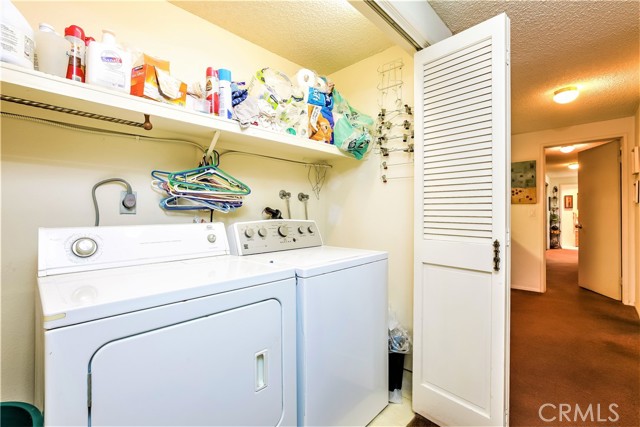 The Laundry Area in the Hallway is Large Enough to accommodate a Full Size Washer and Dryer, as well as Providing Additional Storage