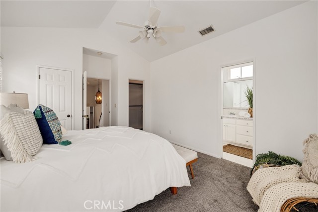 Main bedroom, dual walk in closets Vaulted ceilings