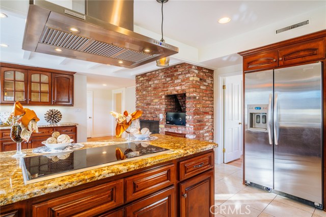 The beautiful kitchen features granite Counter tops, 5-burner Wolf range, stainless appliances, double convection oven and more.