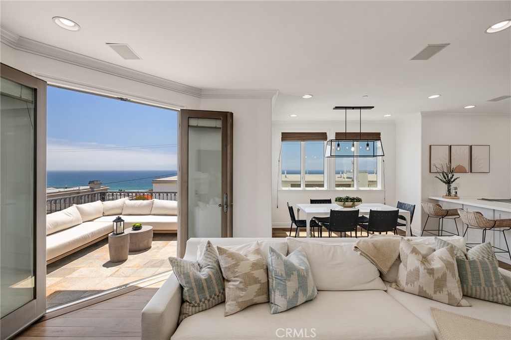 Buyer Agent Commission is 2.5%. Ready to watch fireworks, surf, and sailboats? Enjoy massive ocean views from the Manhattan Beach Pier to Catalina and Palos Verdes. This south facing home is situated on a special street in a prime, A+ location. Enjoy five-car parking for you and your guests as you will be walking to town, the beach, park, and award-winning Grandview Elementary School. An abundance of natural light illuminates the impeccably remodeled and maintained 3 bed, 3.5 bath home. The second floor bedrooms feature en-suite baths, with the primary suite leading to a spa-like bathroom complete with a jetted tub and a walk in shower. Living and entertaining space on the top floor boast high ceilings, an open concept luxury kitchen, and a living area complete with a fireplace and a dumbwaiter to do the heavy lifting. This is a magnificent home, so bring your toothbrush and bathing suit and get ready to enjoy coastal living at its finest!