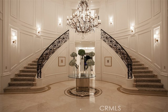813 N Alpine Drive Beverly Hills, California Luxuriously updated 11,000 square foot estate located on The Flat showcases refined materials, exquisite finishes, and impeccable decor throughout. Breathtaking grand entry with cathedral ceiling and dual staircase welcomes guests to a six bedroom, ten bath, custom appointed residence offering the epitome of luxury and grace. Enjoy the lavish chef caliber kitchen with designer-selected finishes, high-end appliances, custom cabinetry, oversized center island, butlers pantry and ample space to entertain. Formal living room, dining room, wine cellar, bar, and media room are ideal for entertaining large crowds or intimate gatherings. Impressive master suite offers a fireplace, dual custom closets, and relaxing spa inspired bath. Two bedrooms are conveniently located on the main floor, as well as fitness room and sauna. Tranquil grounds are beautifully landscaped and highlighted by outdoor patio, pool, spa and fireplace. Dont miss the exceptional quality and rare beauty that is being offered.
