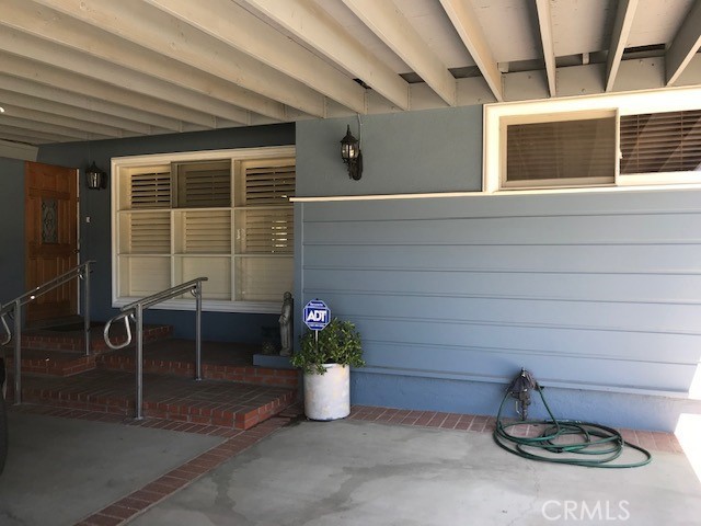 Entry of the house with handicap ramp and railing