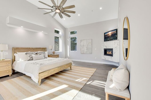 OWNER'S BEDROOM WITH CEILING FAN AND FLOODED WITH LIGHTING