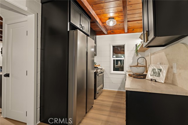 Custom limestone countertops with arched backsplash on both sides of the new galley kitchen!