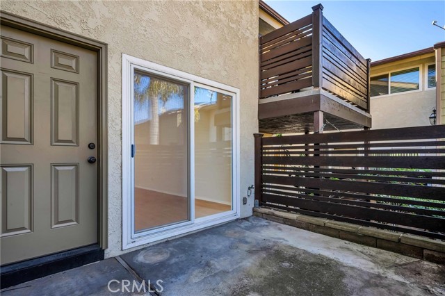 Patio adjacent to living room for enjoying a barbecue or relaxing
