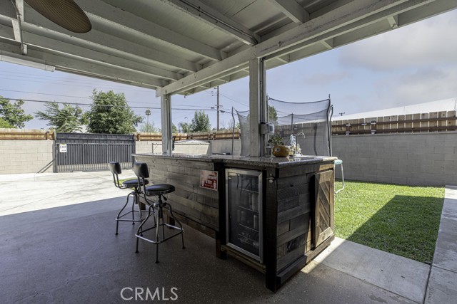 Backyard patio with outdoor bar - daytime