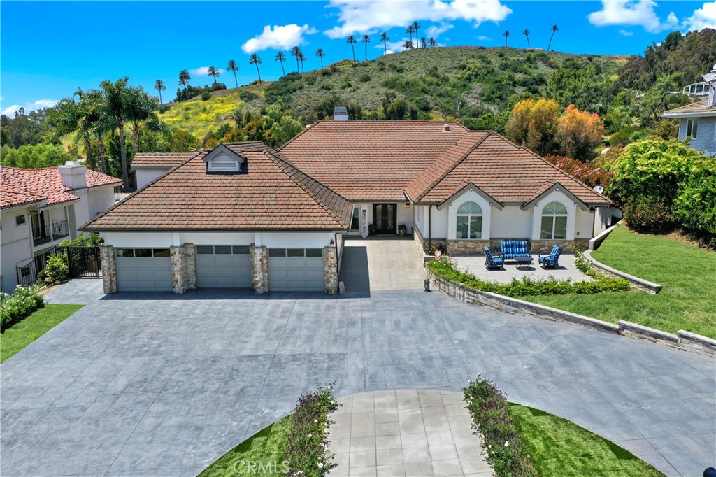 It is my pleasure to introduce the newest listing in the prestigious Hunt Club community located in San Juan Capistrano. This one level home, with ample space for everyone, has everything you need to make memories that will last a lifetime.  Let’s begin with the incredibly spacious backyard that is one of a kind. This amazing space does not disappoint for the grandest moments to everyday comforts.  Did someone say pickle ball?  This is a wonderful venue for hosting your very own pickle ball tournament.  A new over-sized pool and jacuzzi ready for lounging in the afternoon full sun or challenge your friends to some water volleyball.  The upstairs (270 sqft.) sun deck over looks the backyard.  Once the sun does go down, have a seat out by the fire pit and enjoy the evening.  Another grand feature in this home is the generously sized California Room. It features a high pitch roof wrapped with beautiful alder wood.  Come on in and turn on the fire place and get cozy.  Even the master griller has a great view and is close to the  kitchen.  As you enter the home, the first view is of the incredible architecture with wide arches throughout the main living space with an open and elegant feel.  Each living room opens up through bi-folding doors extending to your outdoor living space.  The kitchen over looks the main living room and you can see out to much of the back yard, as well as a small view of the ocean.  The kitchen has been upgraded with a SUB-ZERO refrigerator, a 5 burner WOLF stove top, BOSCH oven and microwave, a COVE dishwasher, and plenty of storage.  The counter tops are Calacata Brasile Leather Quartzite complimenting the slate flooring found throughout the home.   A Water Boy water filtration system has been installed bringing clean water all throughout the home. The home has been repiped, new tankless water heaters, new air conditioning units and includes a four person outdoor sauna.  The four bedrooms are all spacious with 10.5 foot ceilings.  All bedrooms rooms are light and bright.  The master bath is chic and elegant.  The vanity was hand made special for this very space, including a boutique Juliet soaking tub, and the shower was designed with full height porcelain tile.  The entire home has been updated with recessed LED lighting and decorative lighting/fans throughout.  In addition there is a fully finished 500 sqft bonus/game room above the garage; all games and furniture can stay with the home. The Hunt Club is gate guarded and patrolled.