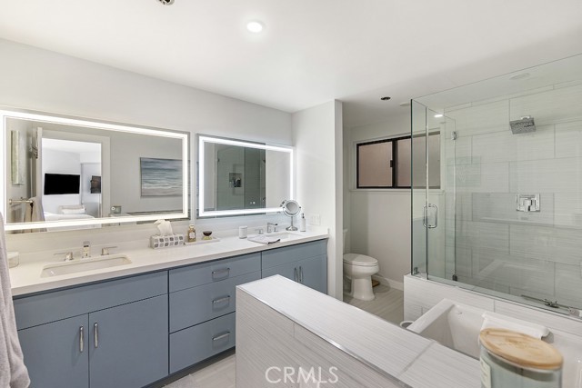 Master bathroom: double vanities with LED/defrost mirrors, jetted tub, walk-in shower