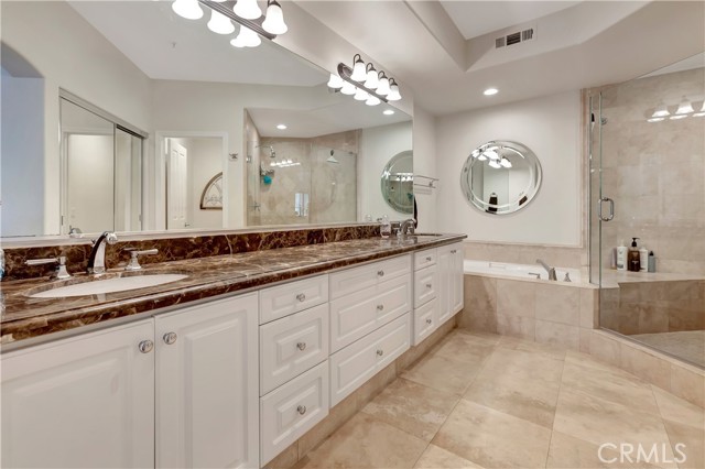 Large dual sink vanity, soaking tub and large walk-in shower