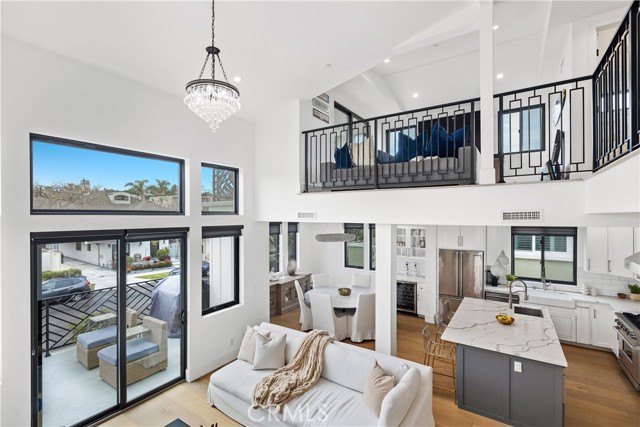 Soaring Ceilings Distribute Natural Light Throughout This Beautiful Home