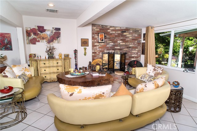 FAMILY ROOM WITH INVITING FIREPLACE
