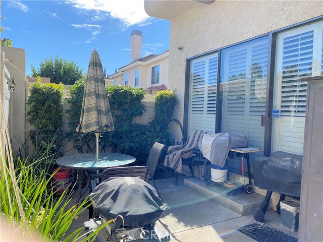 Sliding glass doors with custom plantation shutters.