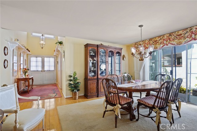 Formal dining area with gracious front foyer entry way