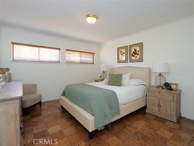 Primary bedroom with refinished wood floors and fresh paint