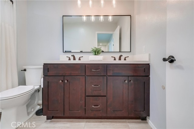 Full bathroom with double sinks secondary bathroom