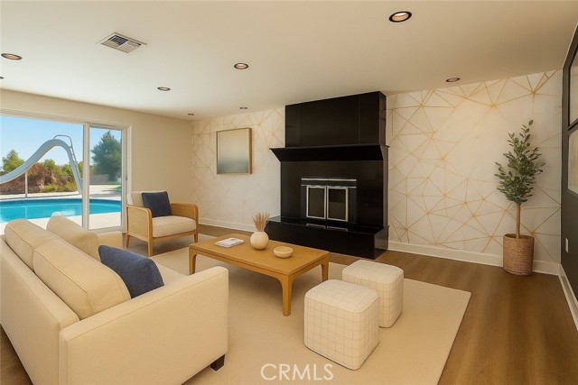 Virtual staging of your family room that leads out to the pool and back yard.