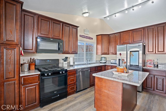 Great looking granite countertops - handsome cabinetry and perfect sized island for entertaining!