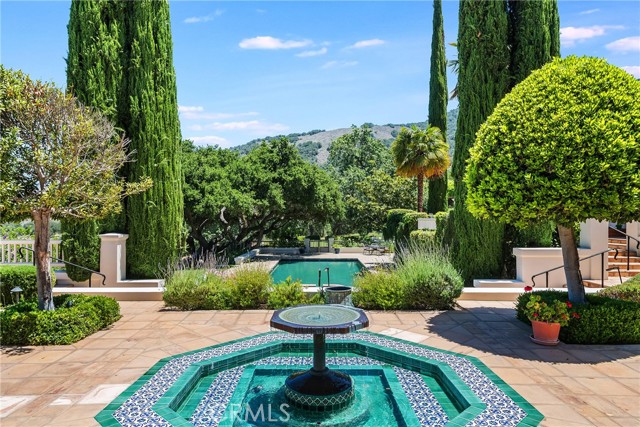 backyard fountain with views to the pool