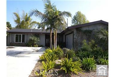 13322 Diamond Head Drive Tustin, California Fantastic Remodel, Beautiful wood-like ceramic tile throughout living room, family room, hall and master bedroom, Soft-modern Deco Style, 3 large bedroom, 2 highly upgraded baths, extremely nice street. Newer carpet in 2 bedrooms, Nice paint, remolded kitchen all new kitchen cabinets, stainless steel appliances, including refrigerator and new counter tops. Single level with attached 2 car garage. Refreshing tropical backyard featuring bamboo vibe, rock waterfall and covered patio.