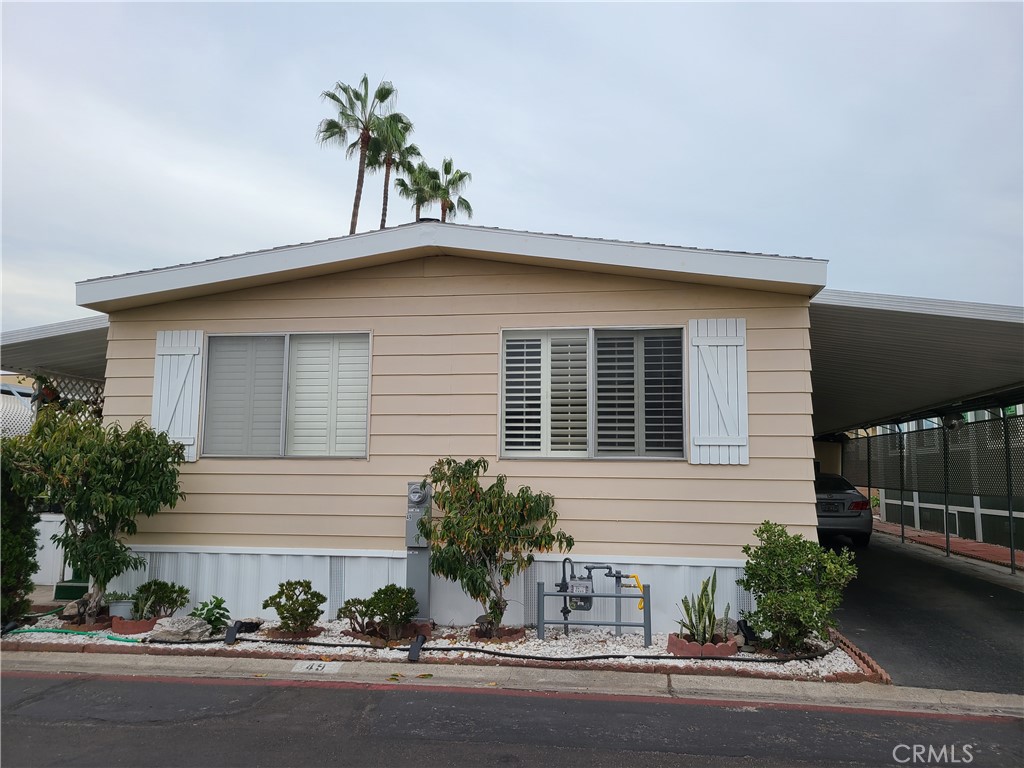 323 N Euclid Street 49 Santa Ana, California Welcome Home! This spacious 1440 sf home features a fully ENCLOSED PORCH adding an additional 200sf (approx.) to the home's utility! Spacious 3 bedroom, 2 bathroom home in an AMAZING all-age community. Upgrades throughout the home include new Granite Kitchen Counter tops, wooden Plantation Shutters that combine beautiful from AND function, New Guest Bathroom Vanity, and New Flooring throughout the home! This unit includes Central A/C to keep cool during the heat waves. Washer/Dryer Hookups in the unit by the Kitchen and Carport entrance for convenience. Great flow of the common rooms with an Open Concept Living and Dining room! 2 Car Attached Carport includes a storage shed. SANDS ESTATES is an All-Age, Family Community located closed to the 22 FWY and two blocks from the all the activities of Mile Square Park! Park amenities include a community Clubhouse, pool, dog park, Shuffle board court, and car wash station! Don't miss your chance to own your own home in Orange County!