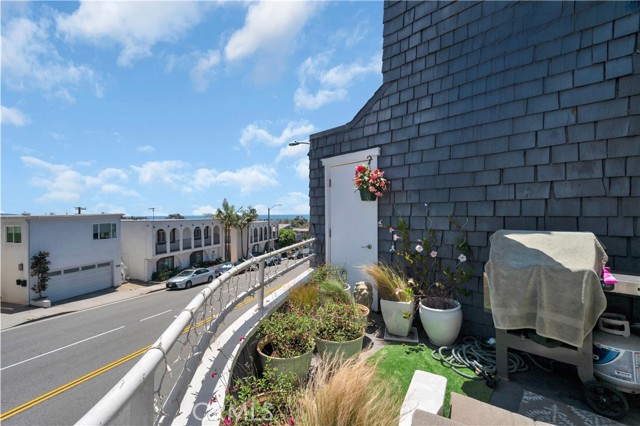 Deck off the living space with partial ocean view