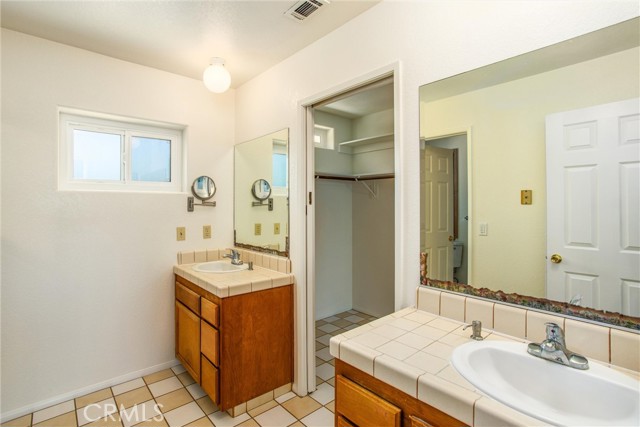 Master bedroom bath with dual sink vanities