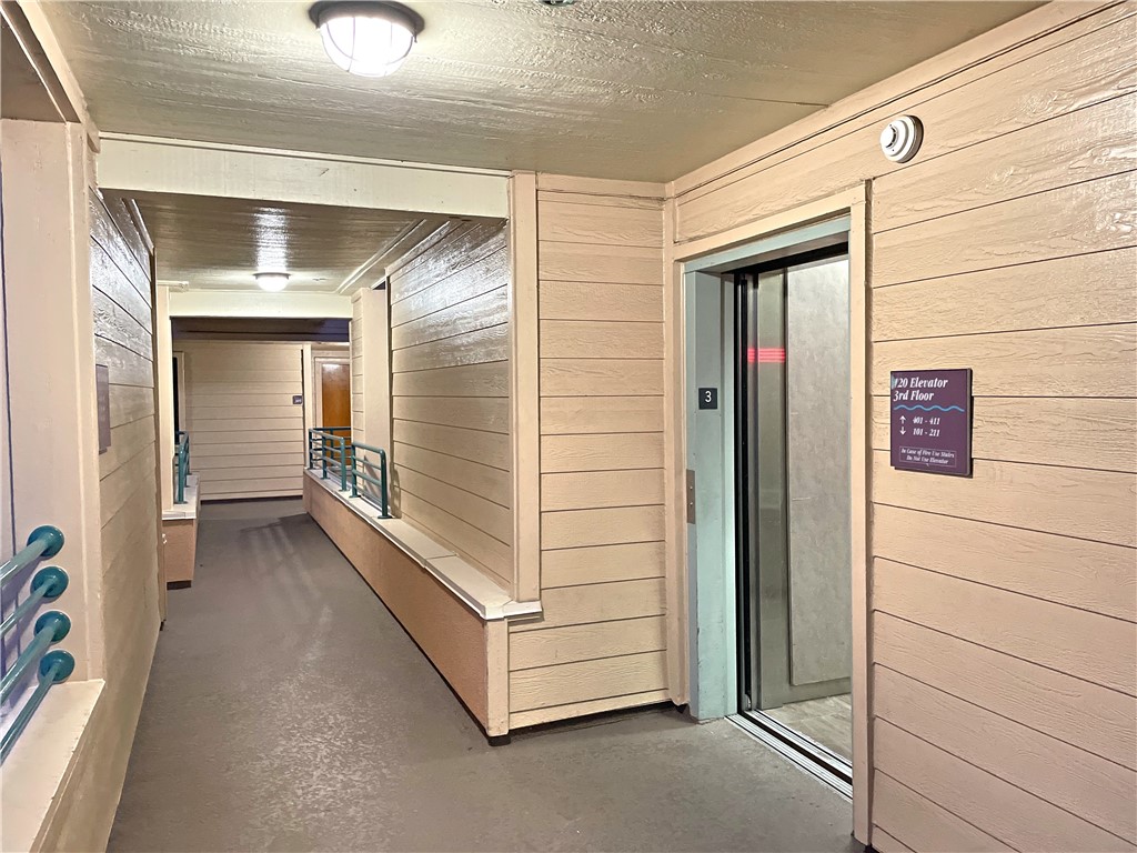 Front door of the home shown from the elevator.  Note that there is a space between so close but no elevator sounds