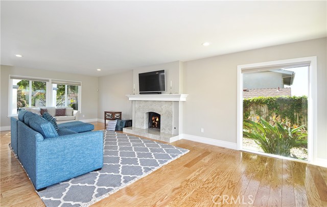 Beautiful stone fireplace and gorgeous oak wood floors make the living room shine.