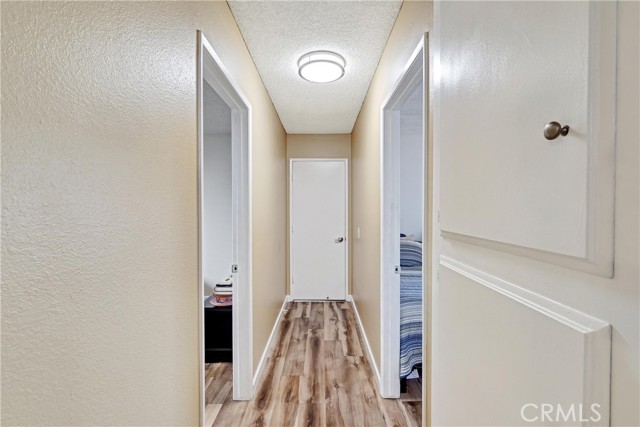 Hallway to garage, with bedrooms 3 & 4