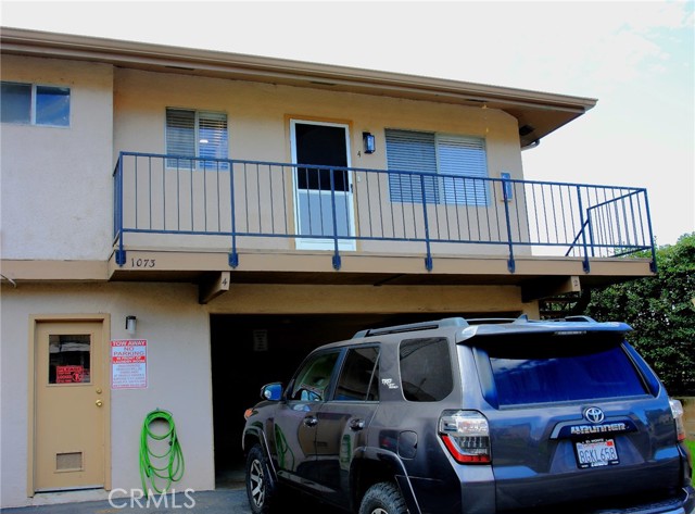 Balcony, main entrance, door below is the laundry room for the 4 units.