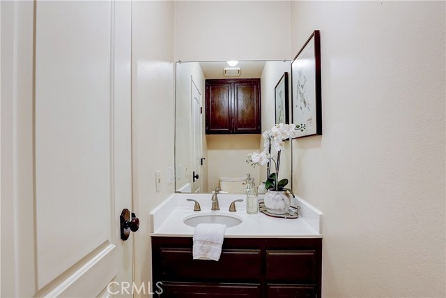 Updated and sleek Powder Room upstairs.