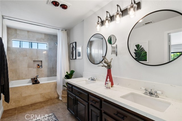 Primary Bath: Remodeled in 2016 with Quartz Countertops, new tiles, large soaker tub and Moen fixtures throughout.