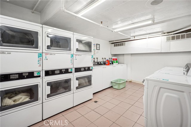 There is a Laundry Room with Numerous Washers and Dryers
