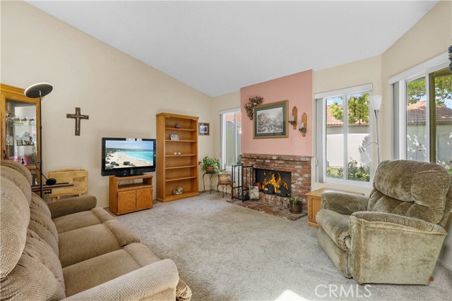 Living room with brick fireplace