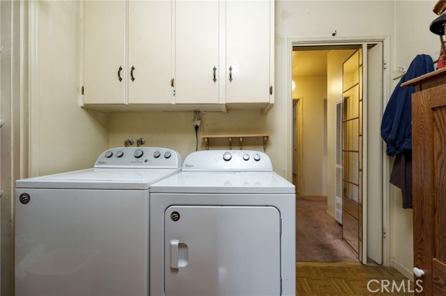 Laundry off kitchen and bedroom hallway